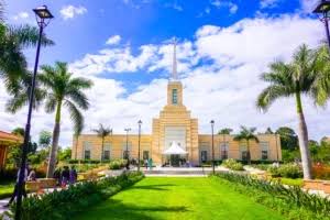 Completed building with palm trees and lawn