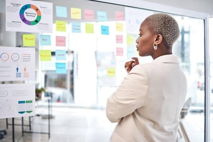 Planner reviewing a project board