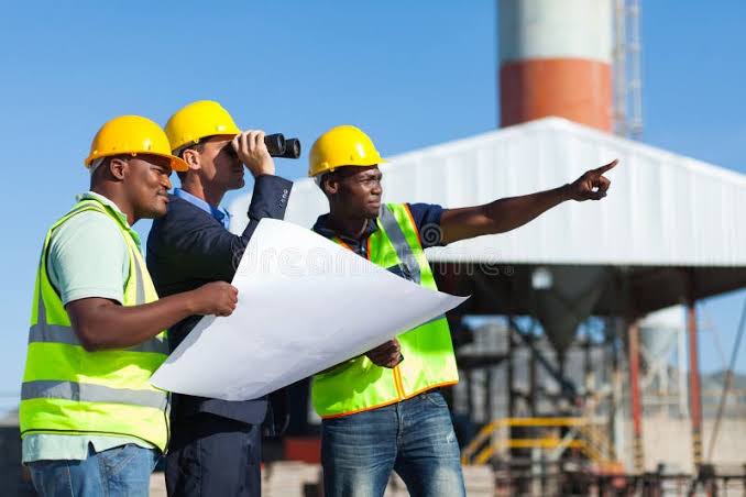 Site team reviewing building plans