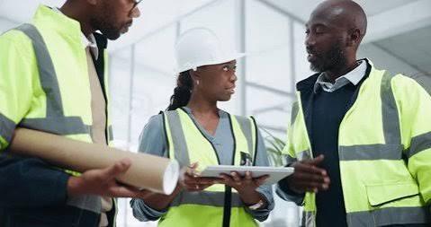 Project team reviewing a tablet on site